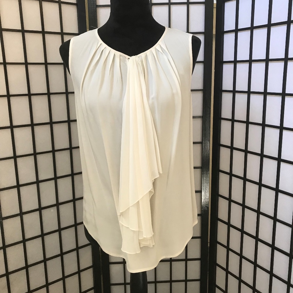 Cream sleeveless blouse